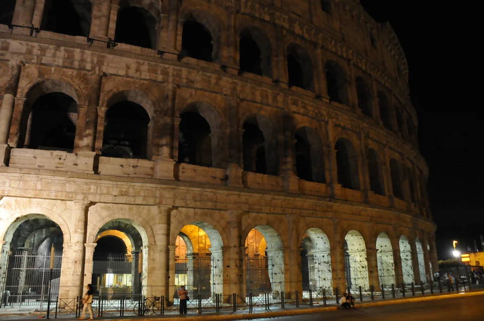 Rome's Colosseum glowing against the night sky
